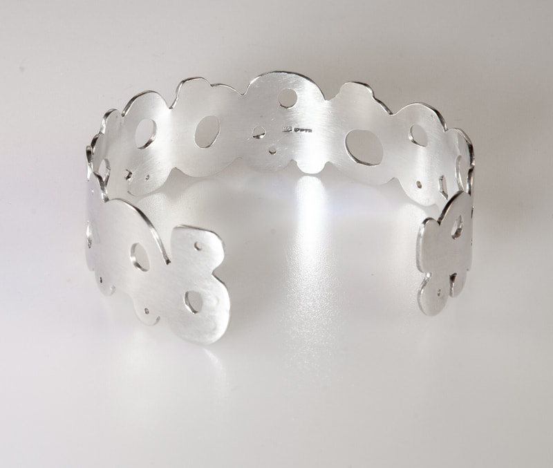 Women's Sterling Silver Bracelet, unique handcrafted cuff with circular geometric shapes looks absolutely amazing with any outfit