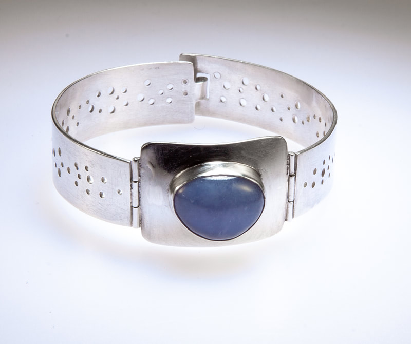 Women's Sterling Silver Dot hinged bracelet with blue Larimer Stone - make that special someone feel cherished this Christmas with this gift